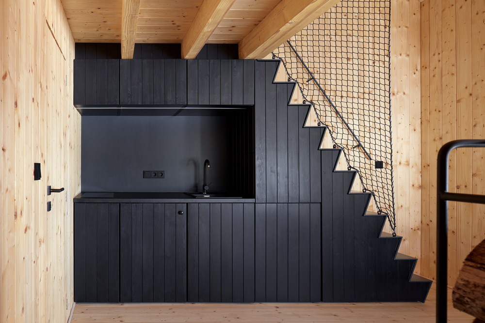 Black Kitchen Cabinets Under the Stairs