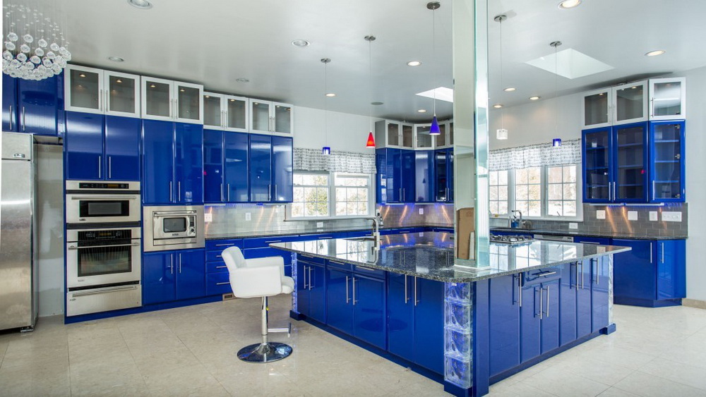 Bright Blue Kitchen Island With Marble Countertops