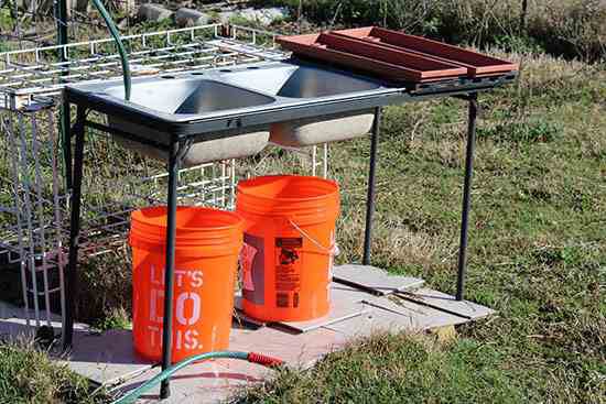 Outdoor bucket dish washer from Salvaged Materials